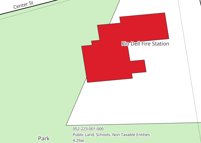 Detail of a map with a green area dominant labeled as "Park", and a red outline labeled "Rio Dell Fire Station" as well as some additional smaller text including a parcel number and zoning information